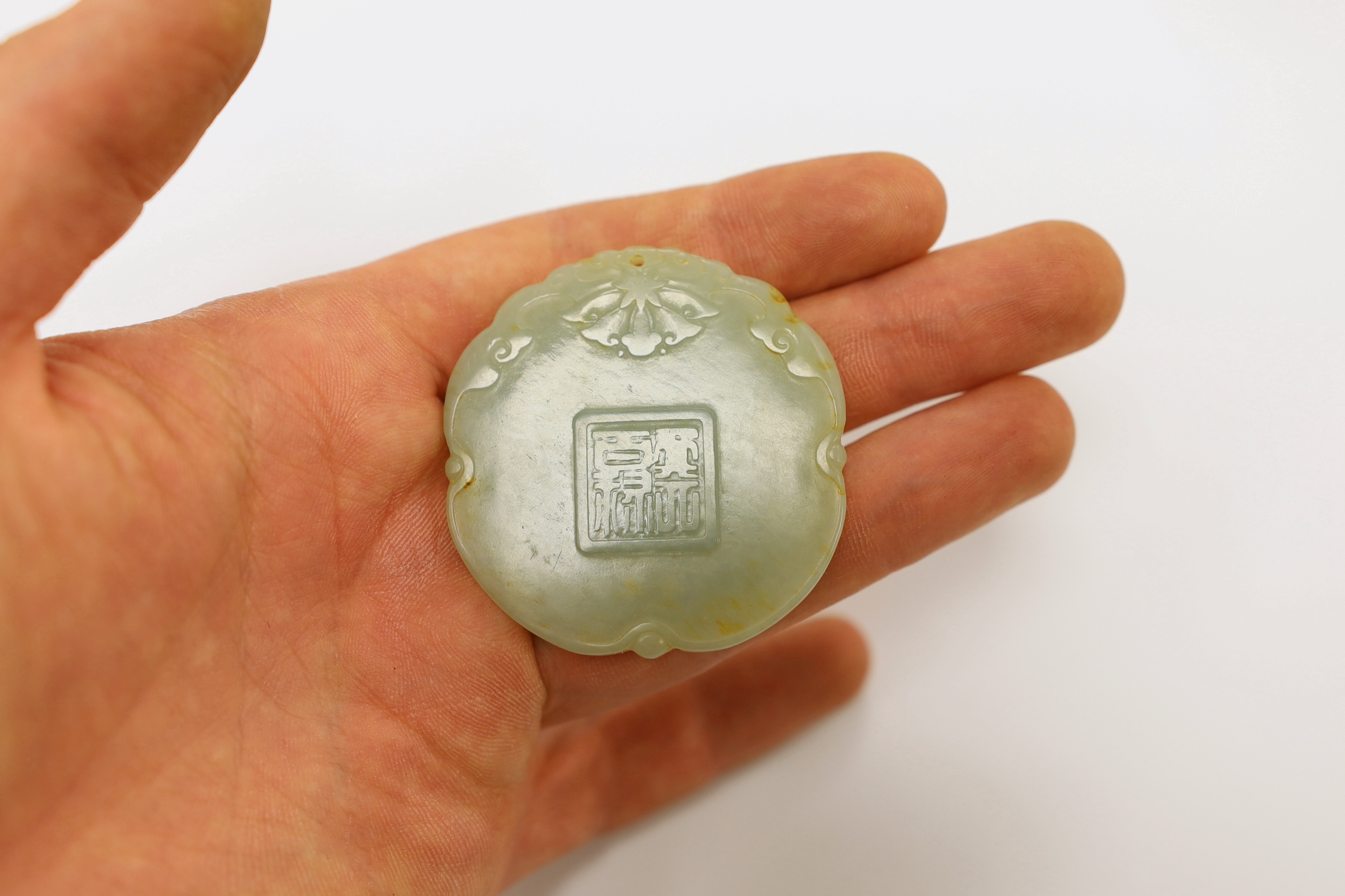 Two Chinese carved jade pendants, largest 6cm